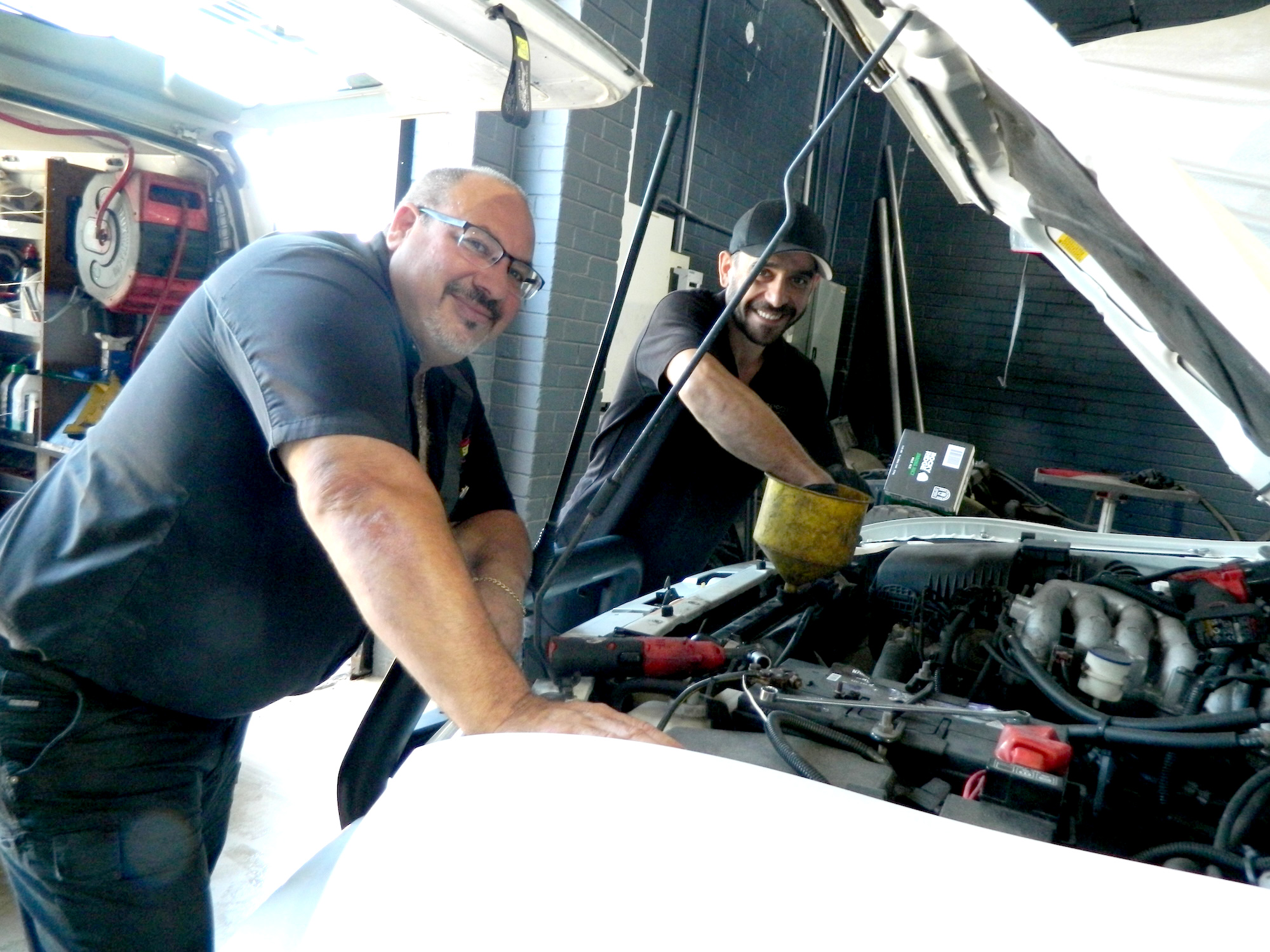OPSC mechanics working on a vehicle